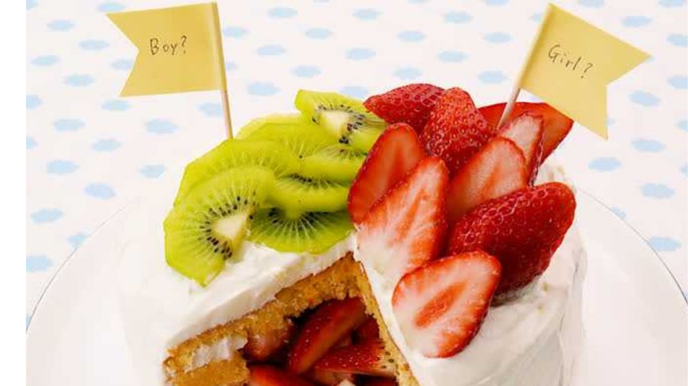 ピンク色のクリームがあふれるジェンダーリビールケーキ